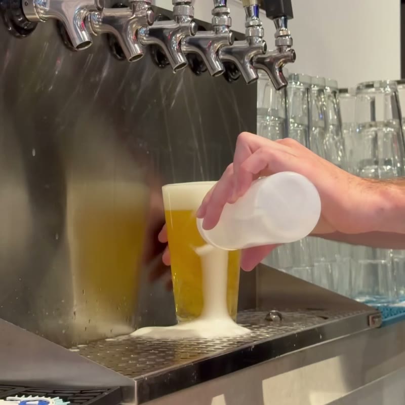 A beer being poured from the taps at Birdie Lounge