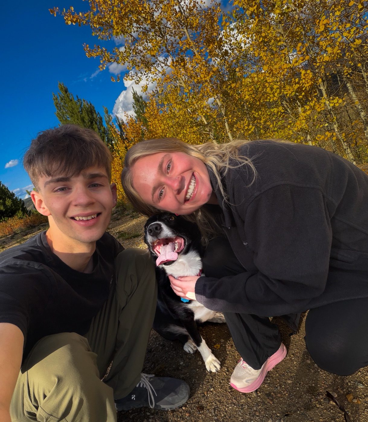 Gage and Grace with Mouse the border collie under fall aspens